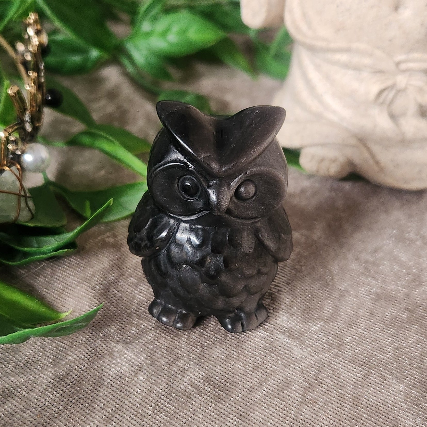 Polished silver obsidian owl crystal carving with detailed feathers