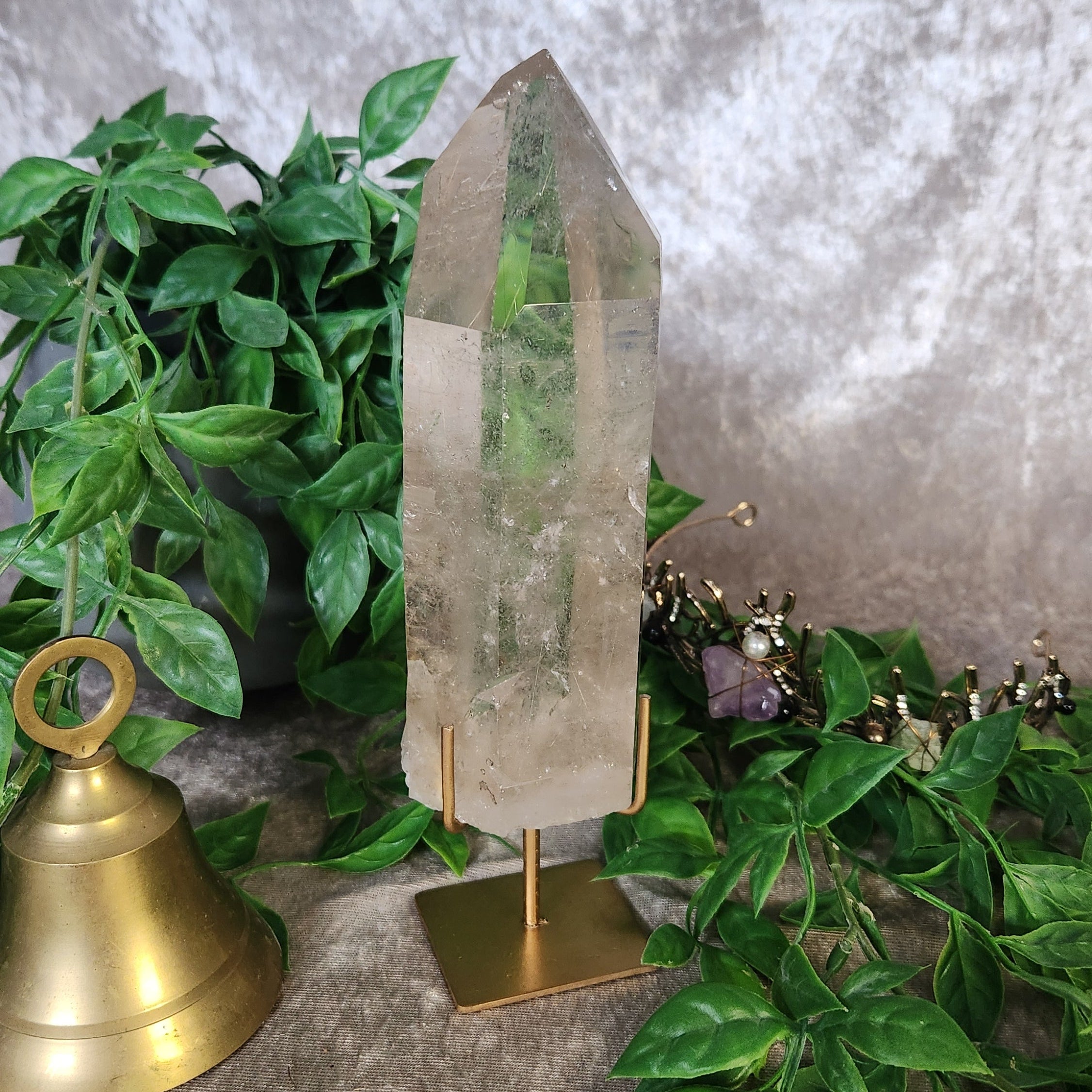 Brazilian clear quartz point on stand with natural crystal clarity