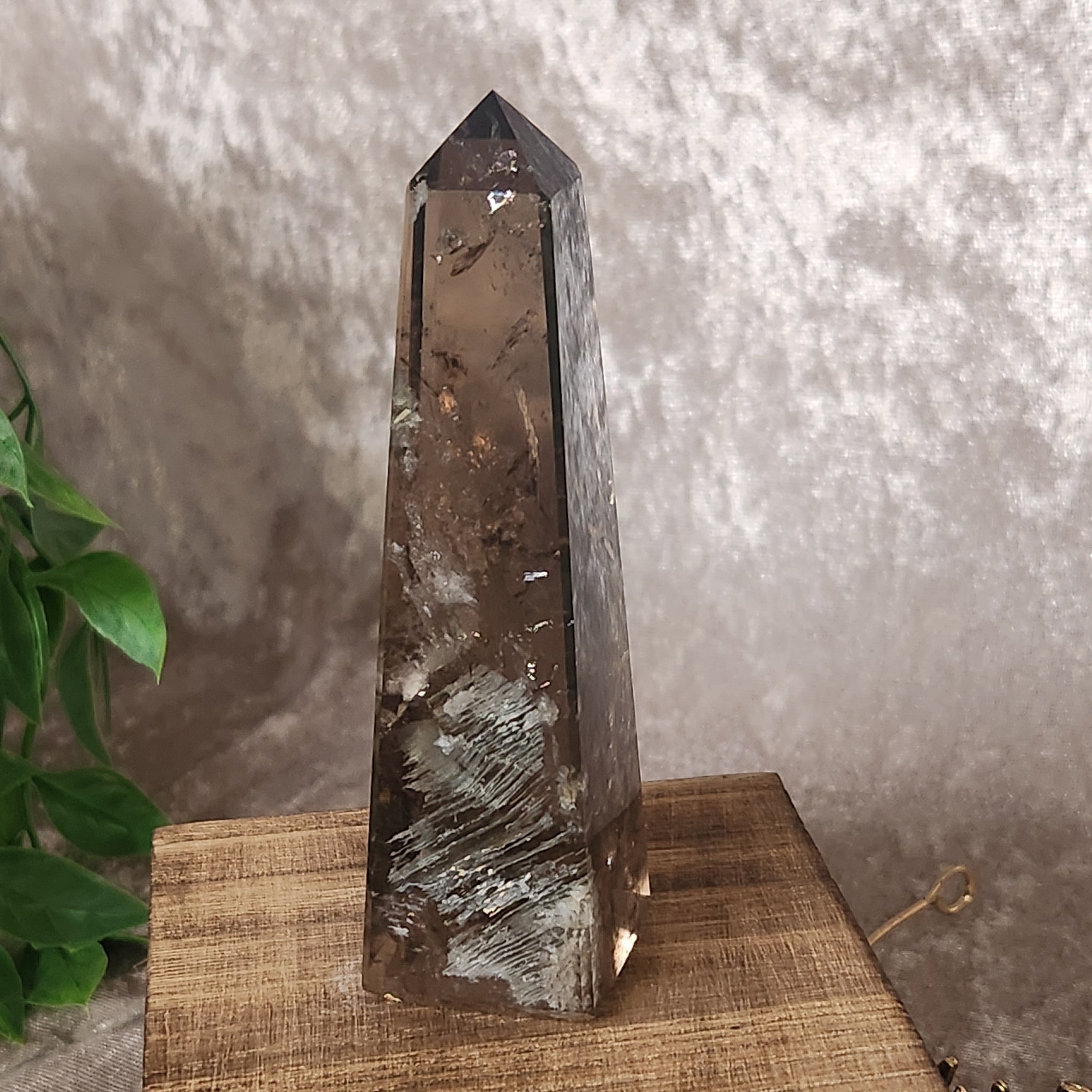 Smoky Quartz tower with natural internal fractures and polished finish
