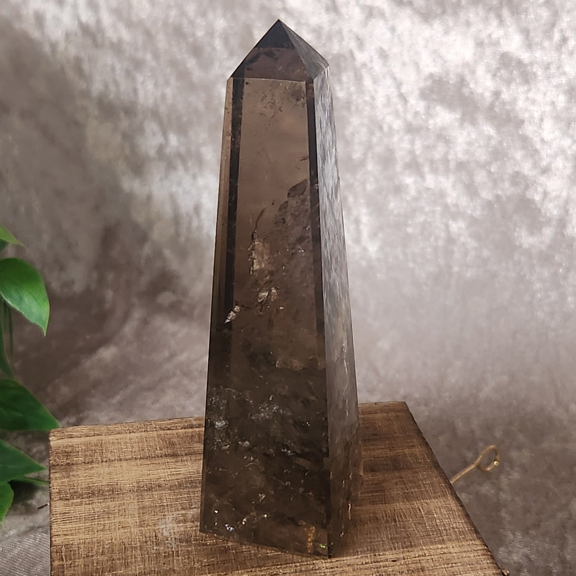 Polished Smoky Quartz crystal tower with internal veils