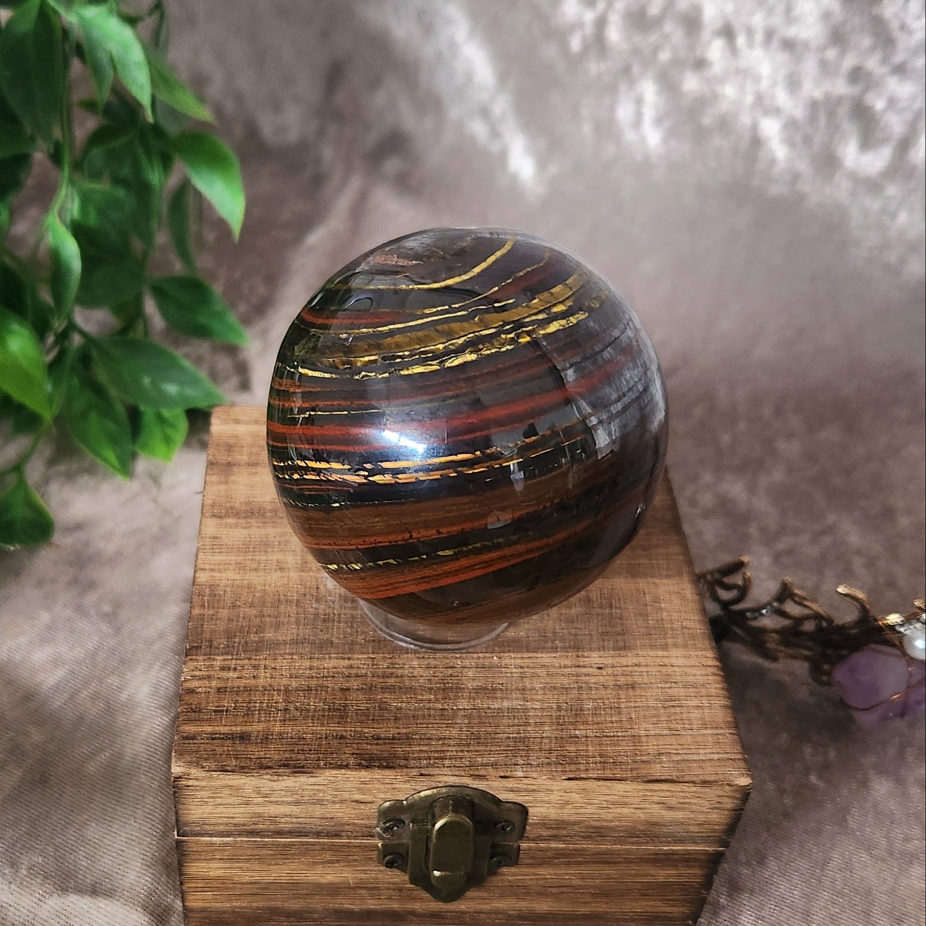 Tiger Iron sphere with bold natural striping and smooth polished finish