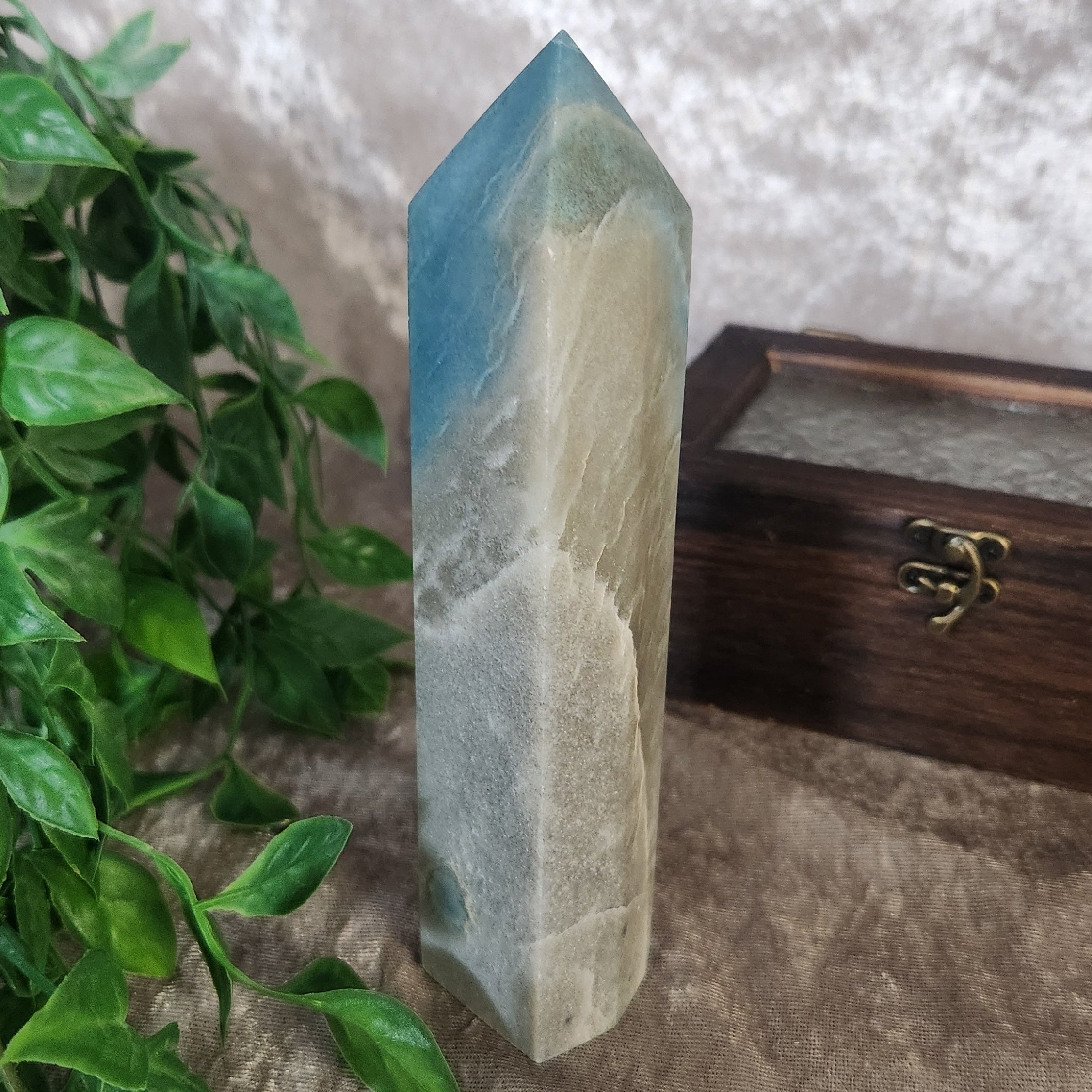 Troilite crystal tower with natural texture and deep smoky colouring