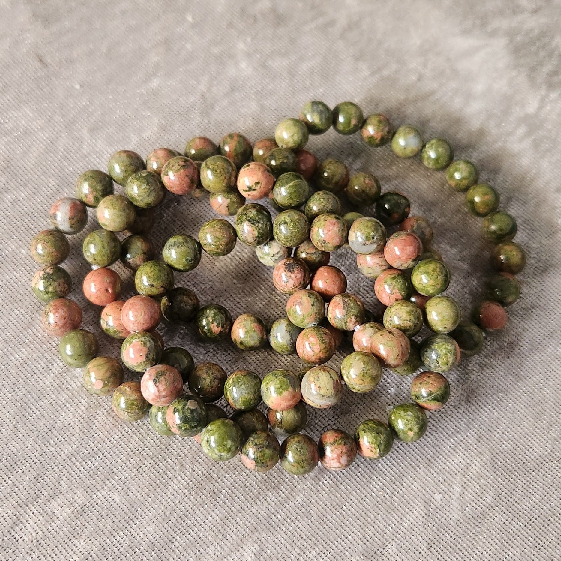 Natural Unakite bracelet displayed on a neutral background