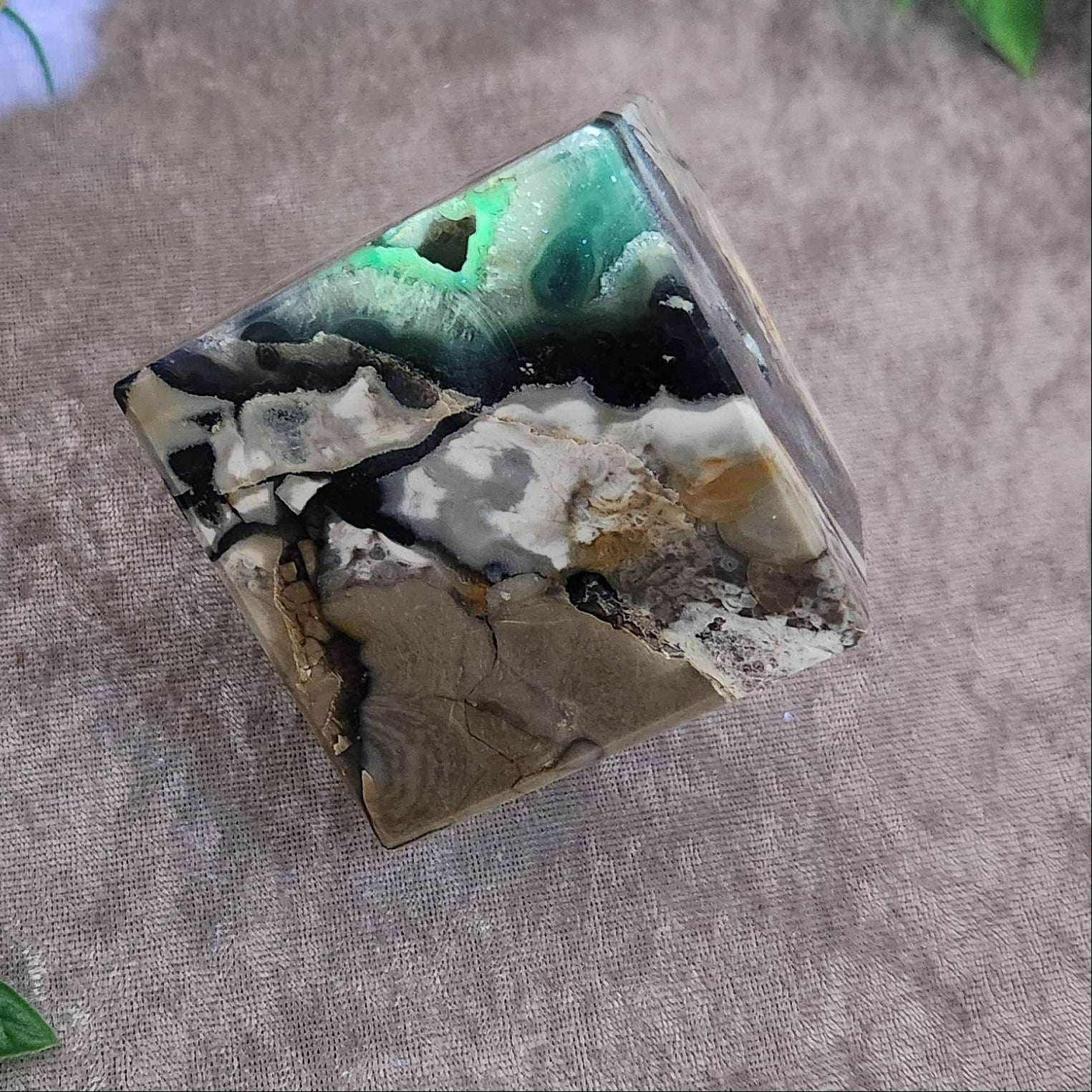 Polished geometric agate cube with organic banding and stabilising presence