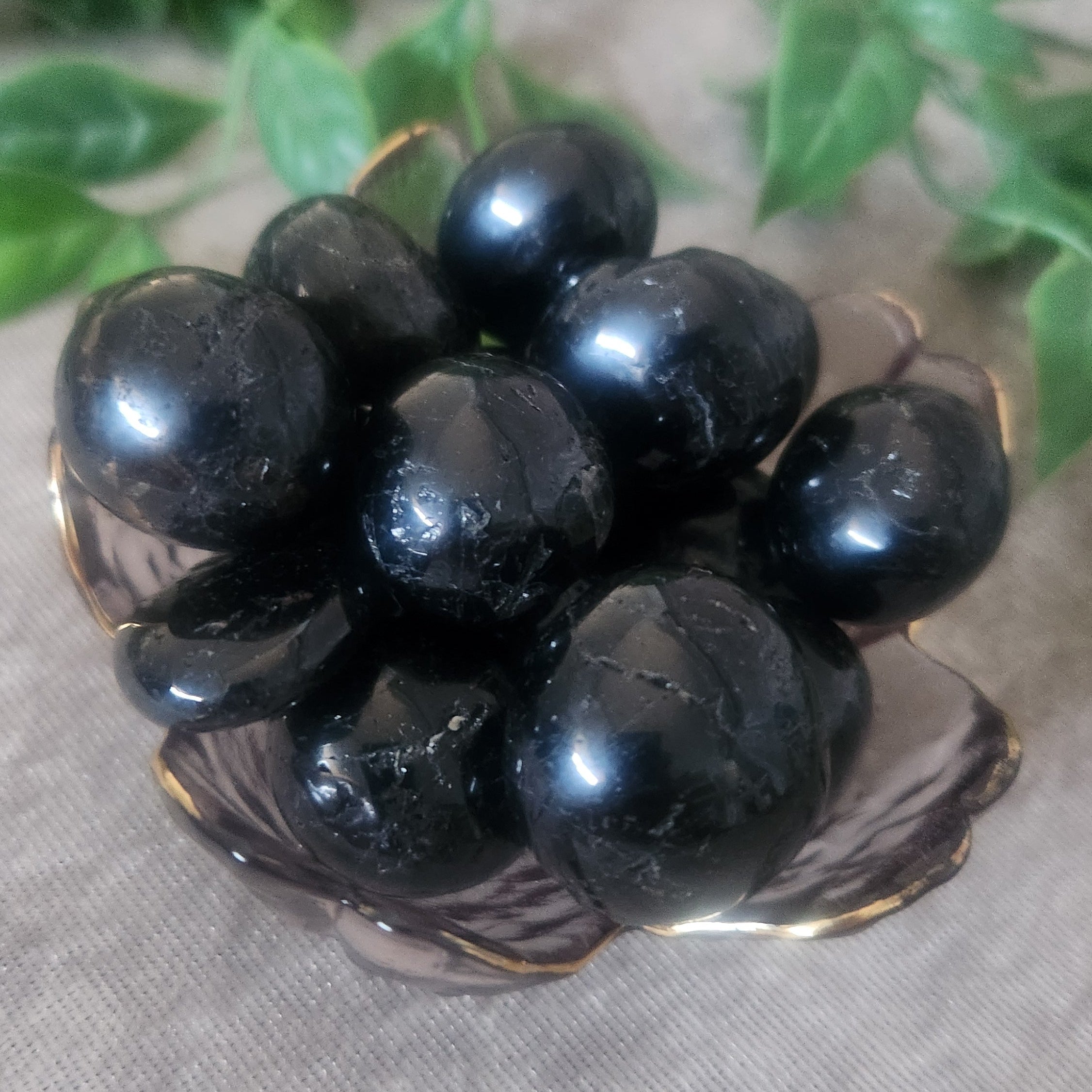 Black Tourmaline tumbled stone with natural striations polished smooth for grounding and protection