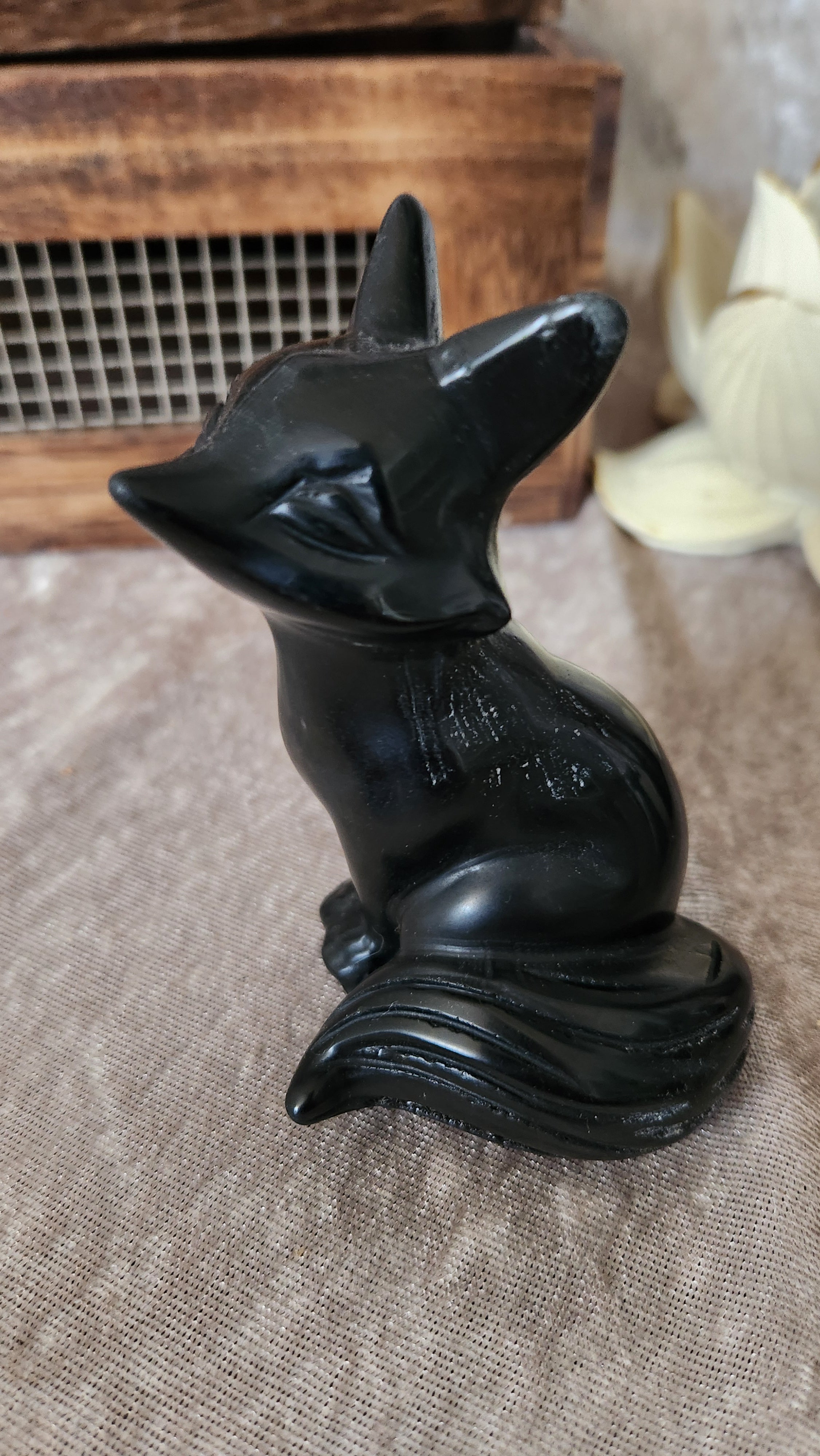 Black Obsidian fox carving. Protective crystal animal totem symbolizing wisdom, magic, and transformation