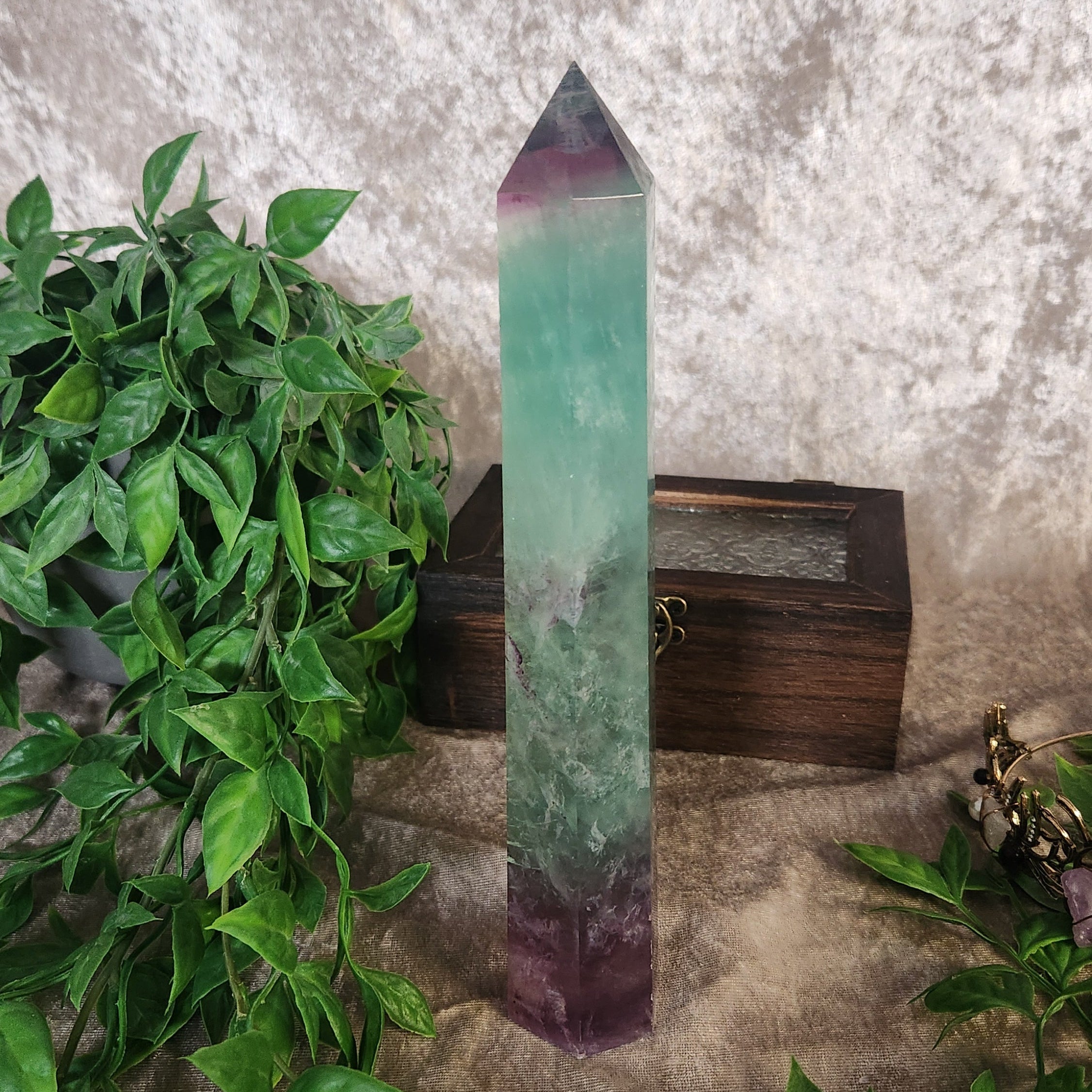 Large rainbow fluorite crystal tower with smooth polished finish and natural colour banding