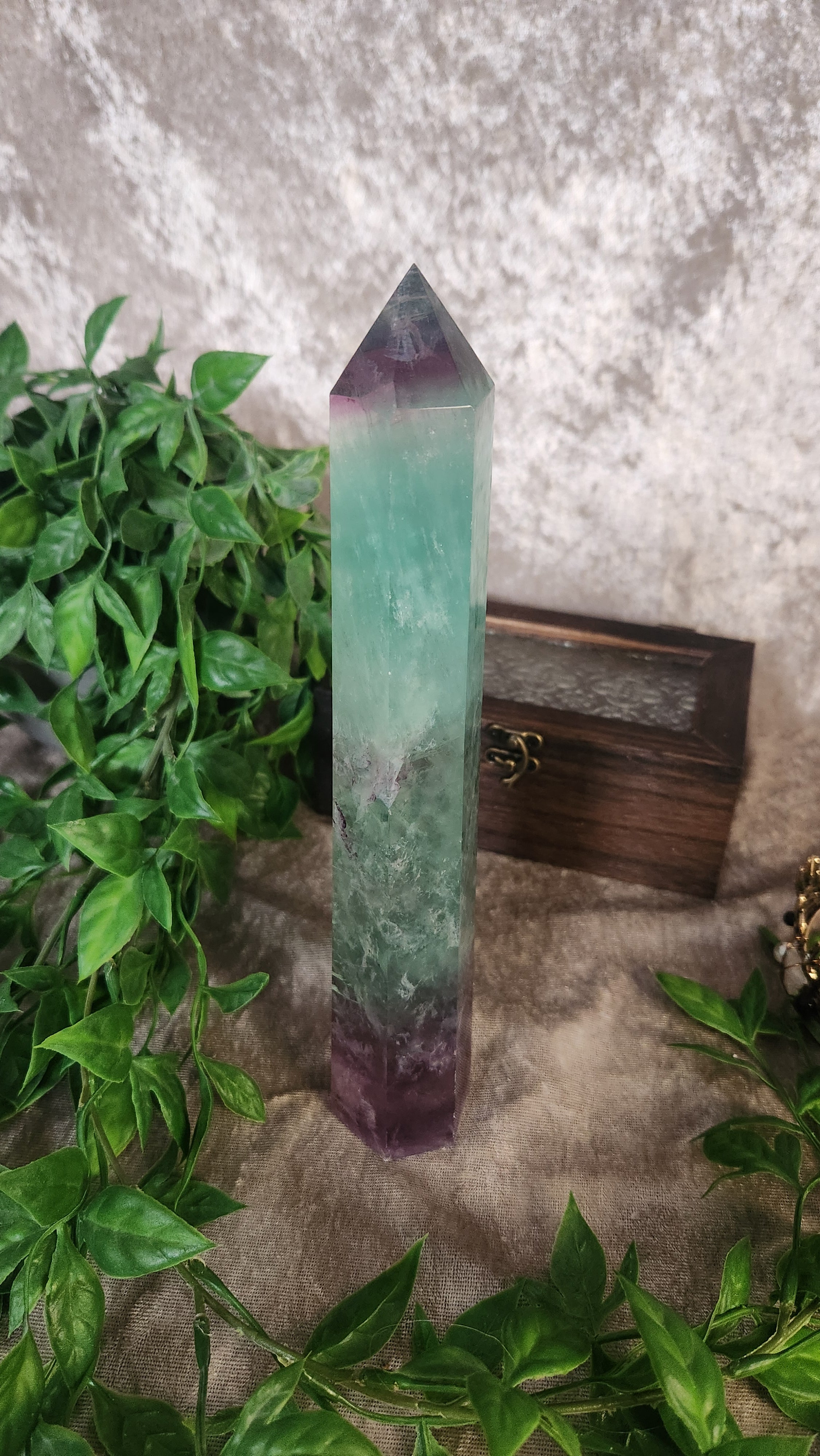 Statement rainbow fluorite tower featuring layered green and purple tones