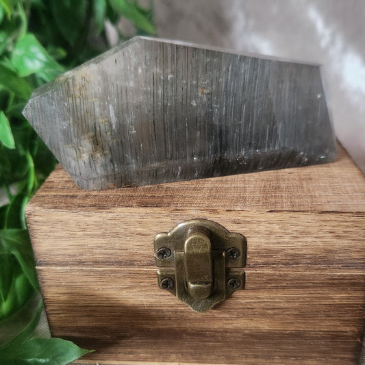 Thousand Layer quartz freeform on vintage wooden box with velvet background