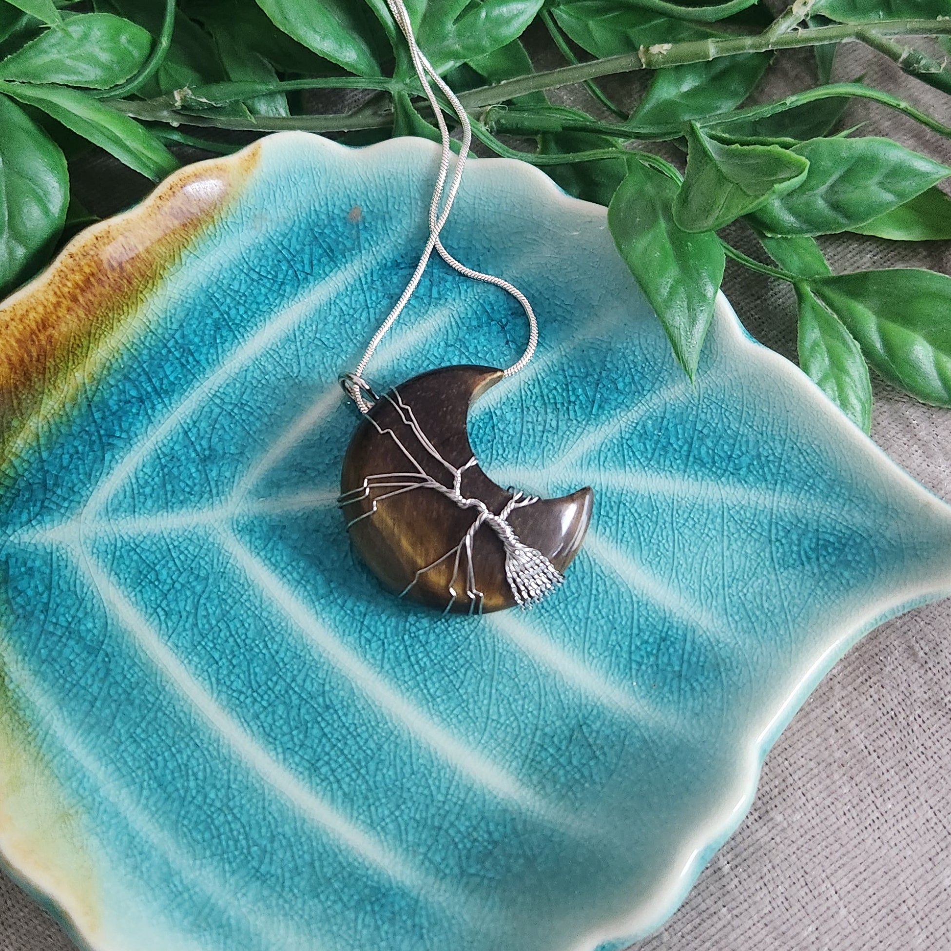 Tiger eye moon crystal necklace symbolising confidence and protection